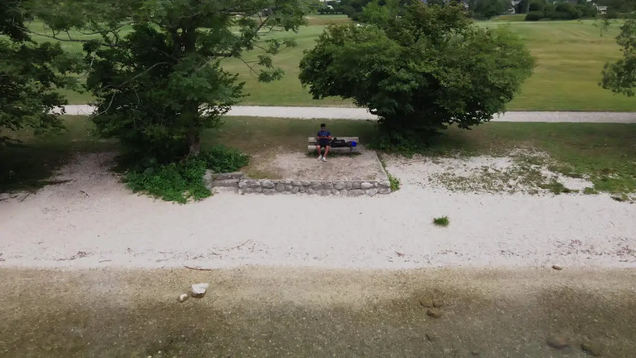 A men flying his drone on Bohinj lake slovenia