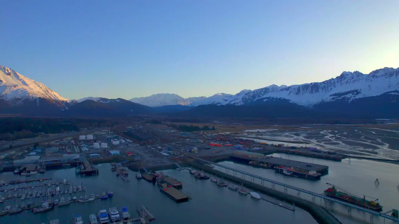 Sunrise panoramic view of mountains and Seward Boat Harbor in Seward Alaska