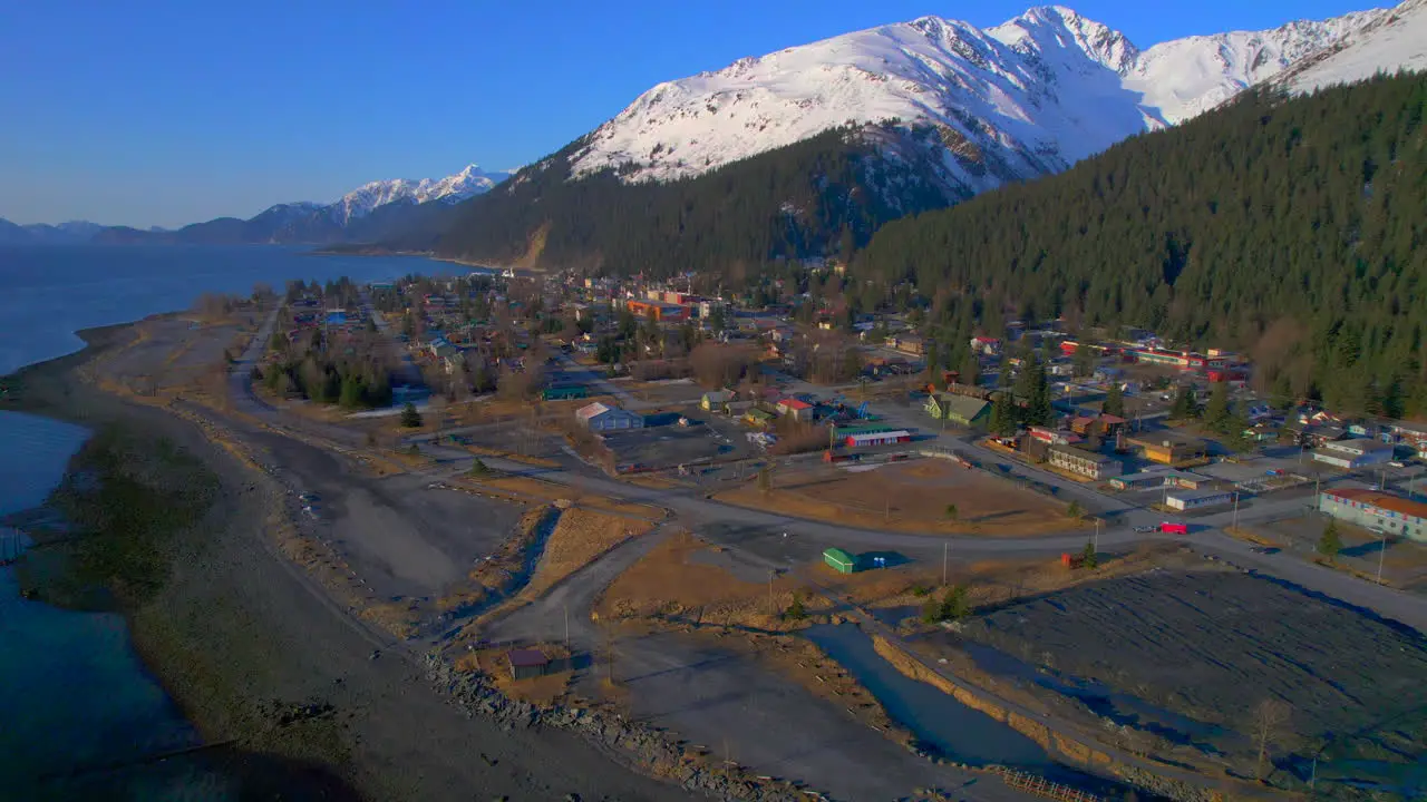 High aerial view of downtown Seward Alaska with mountains at sunrise