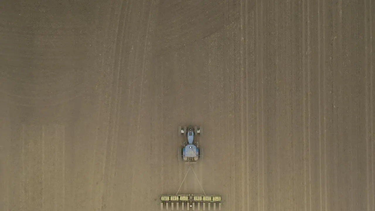 Farmer in tractor cultivating crop in field take 12