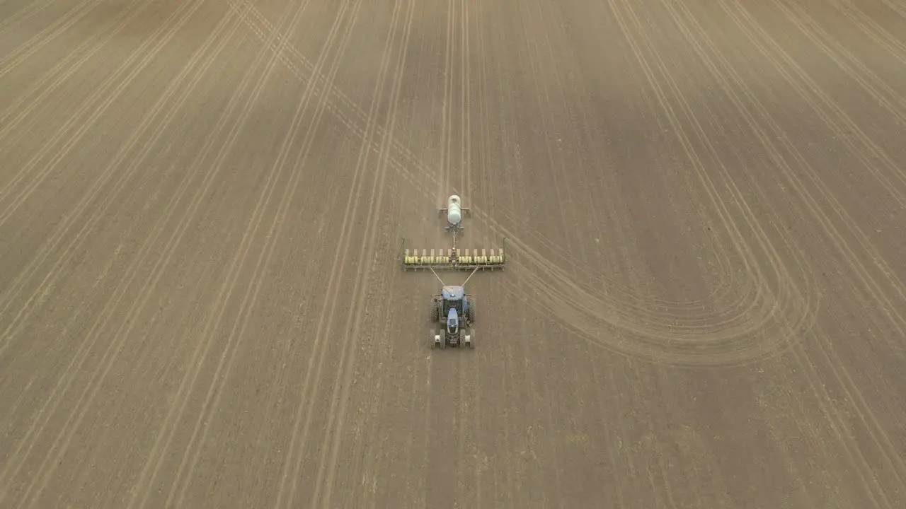 Farmer in tractor cultivating crop in field take 14