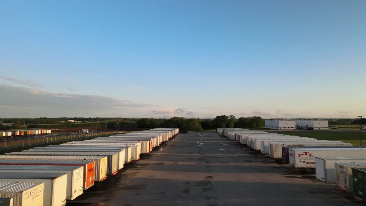 Flying through a storage yard of moving trailers