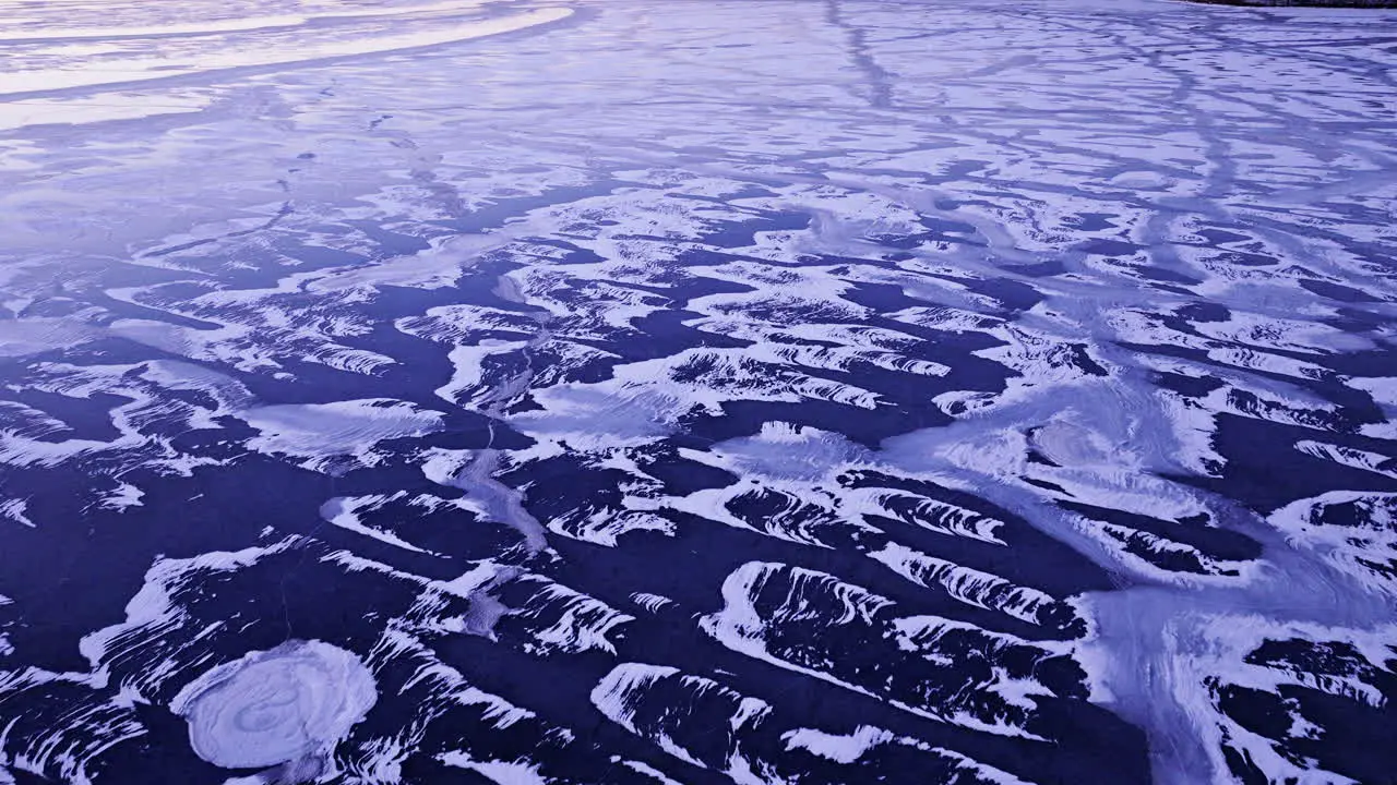 An overhead drone shot revealing the magnitude of ice chunks adrift in the water