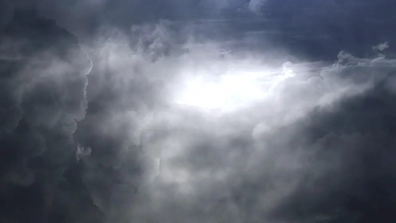 thunderstorm flying through into the dark clouds