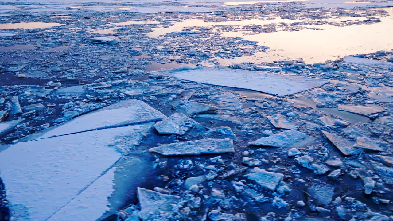 Drone video offering an aerial glimpse of ice blocks in the water