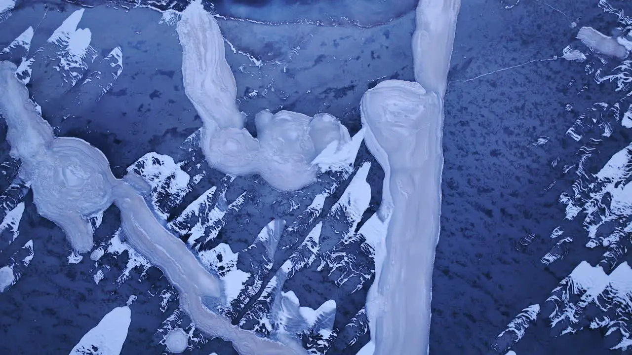 Stunning footage as a drone glides over immense ice formations in the water on a cold winter day