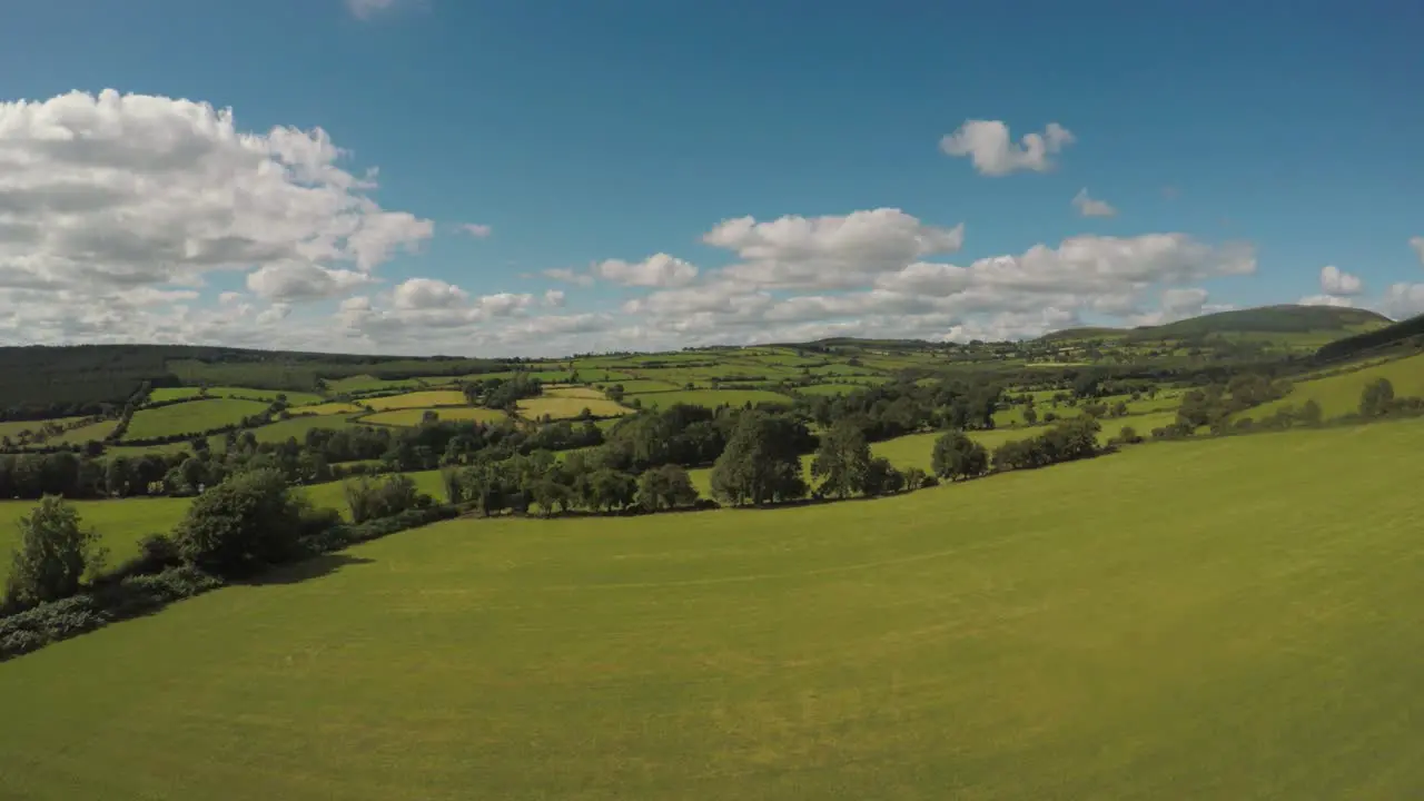 Slowly flying out over the beautiful green rolling fields of Ireland-3