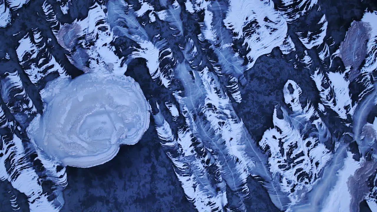 Stunning footage as a drone glides over immense ice formations in the water