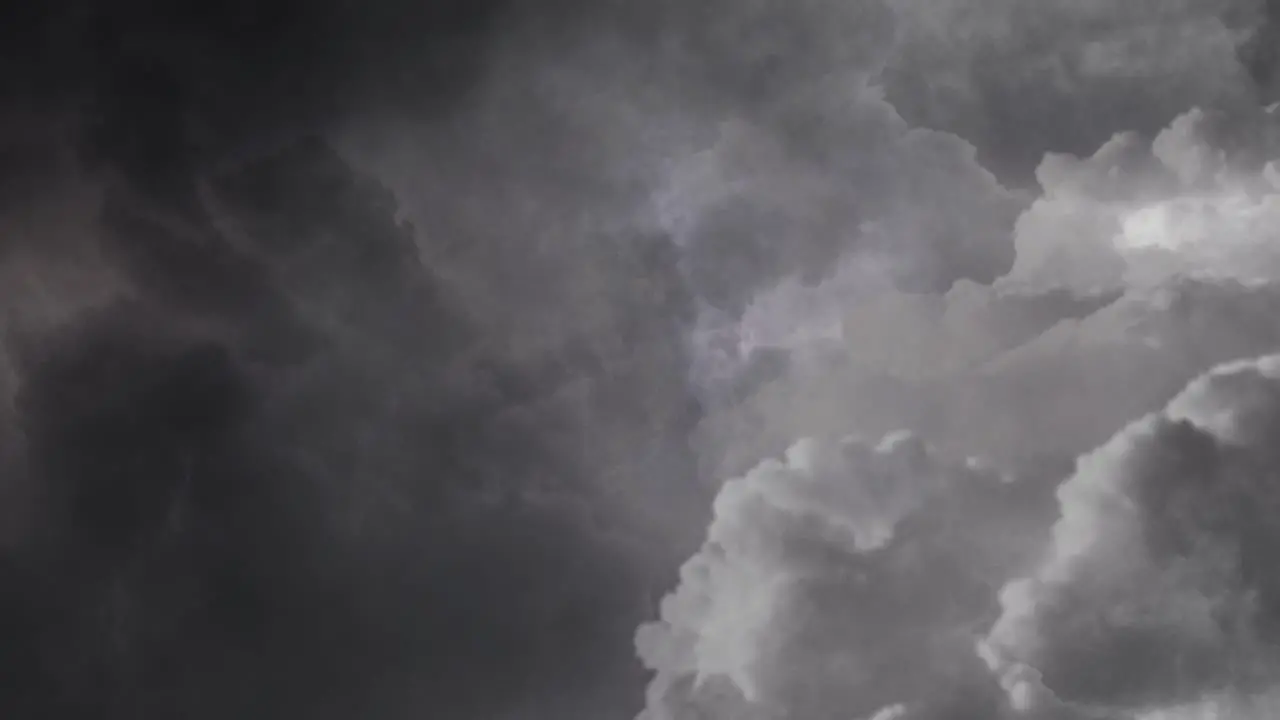 thunderstorm lightning strike inside the dark clouds in the dark sky