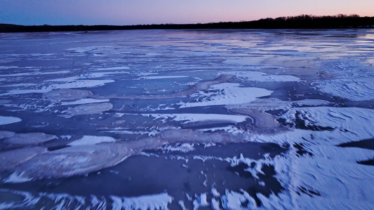 Video from a drone as it hovers above the vast expanse of ice chunks in water