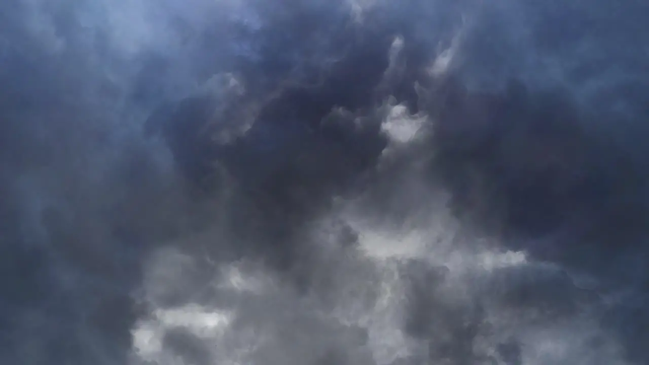 4k Stormy night sky with flashes of lightning