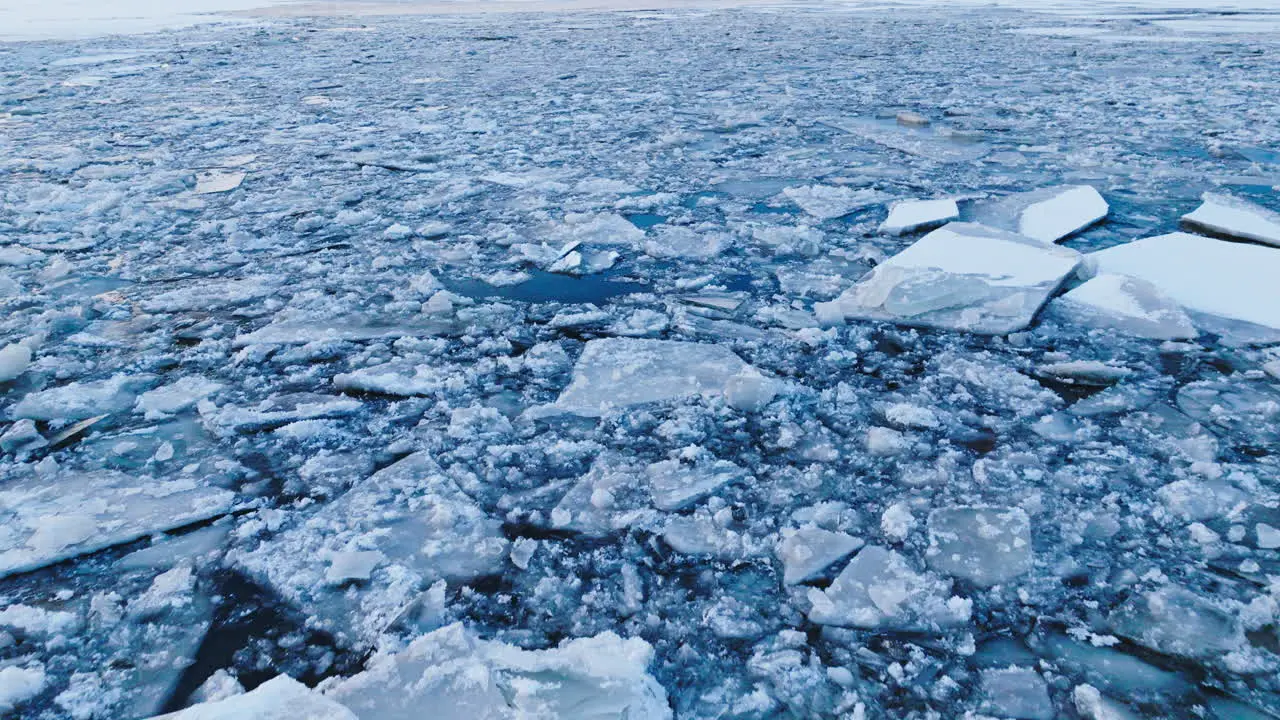 Drone's exploration of the vastness of ice formations in the water