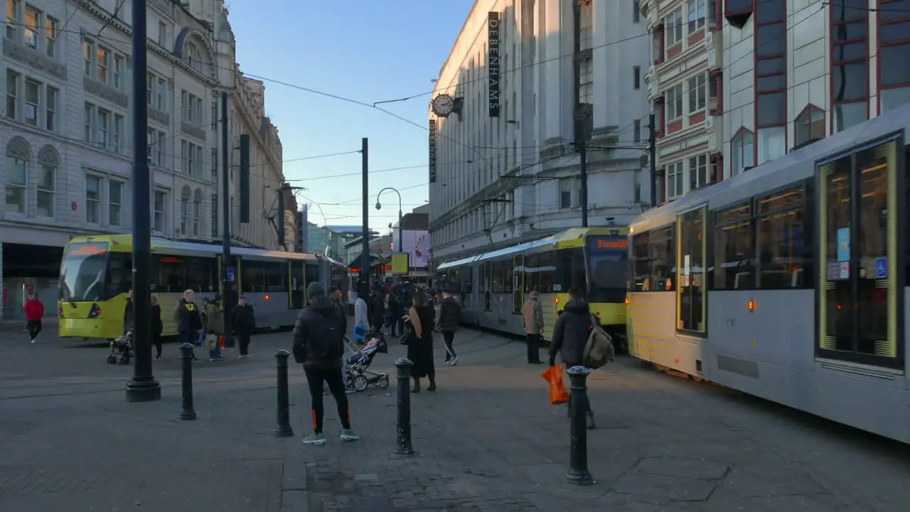 People on trams in Manchester city centre