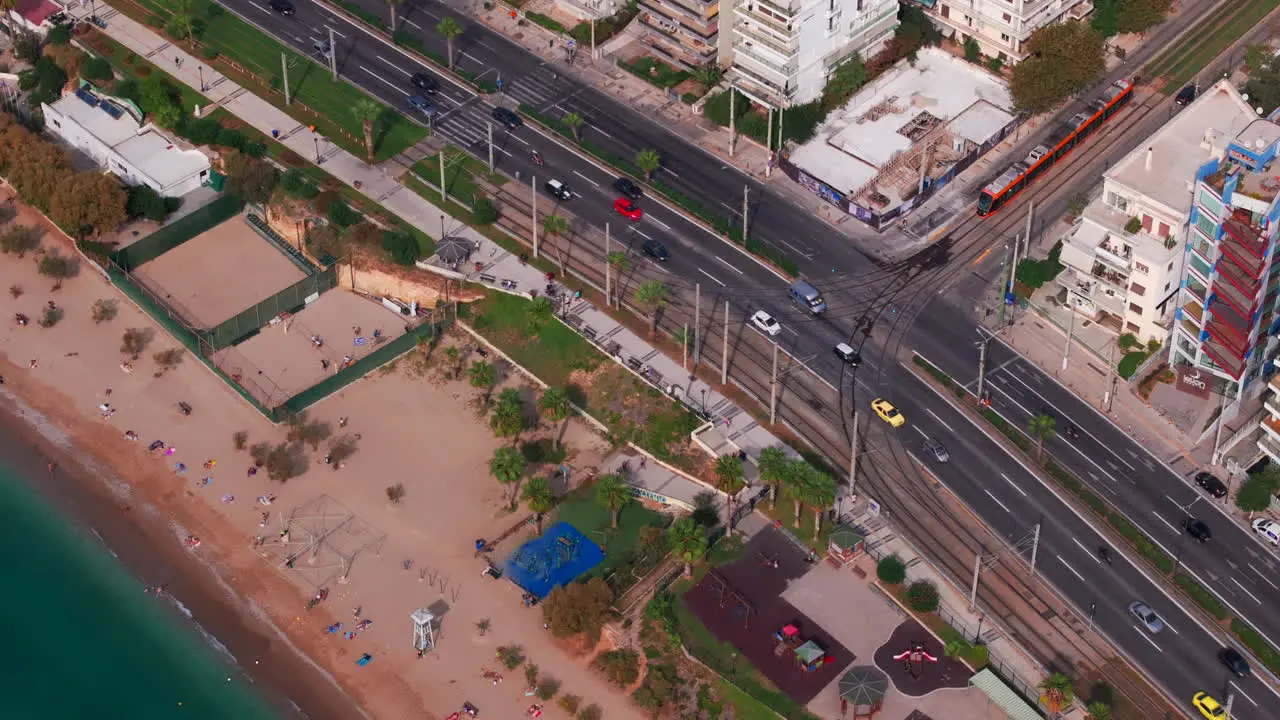 Aerial shot of a tram waiting at a road junction Athens