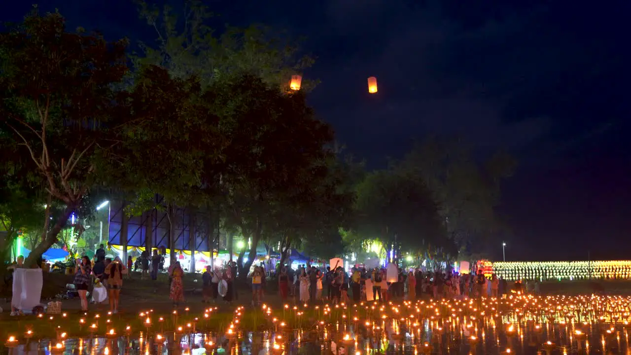 Beautiful scenery during night with Yi Peng lanterns and candles