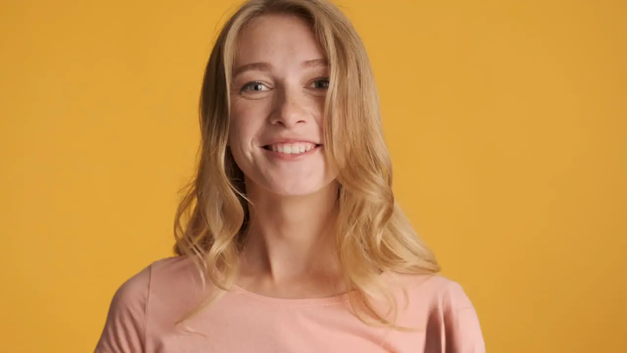 Caucasian woman laughing on camera