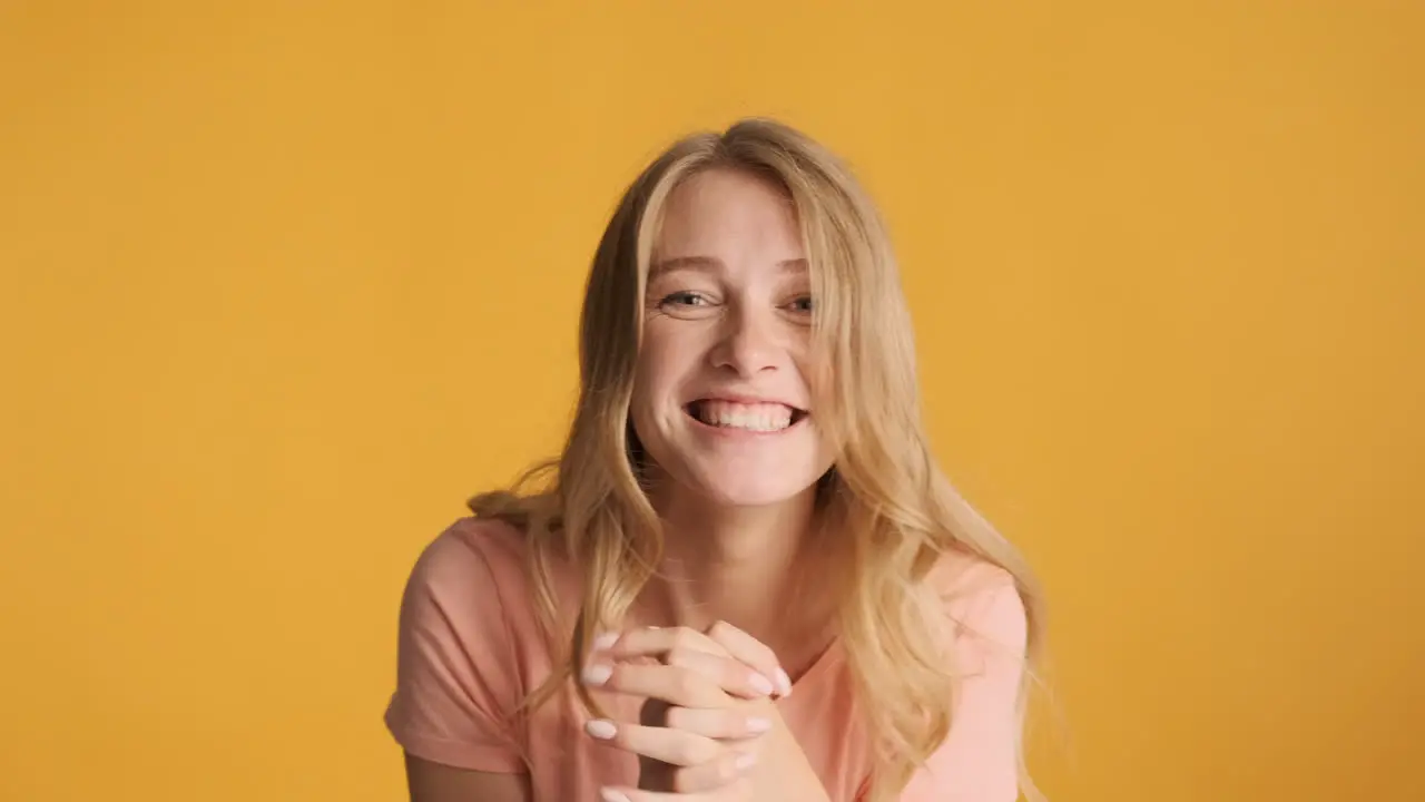 Caucasian woman celebrating victory on camera