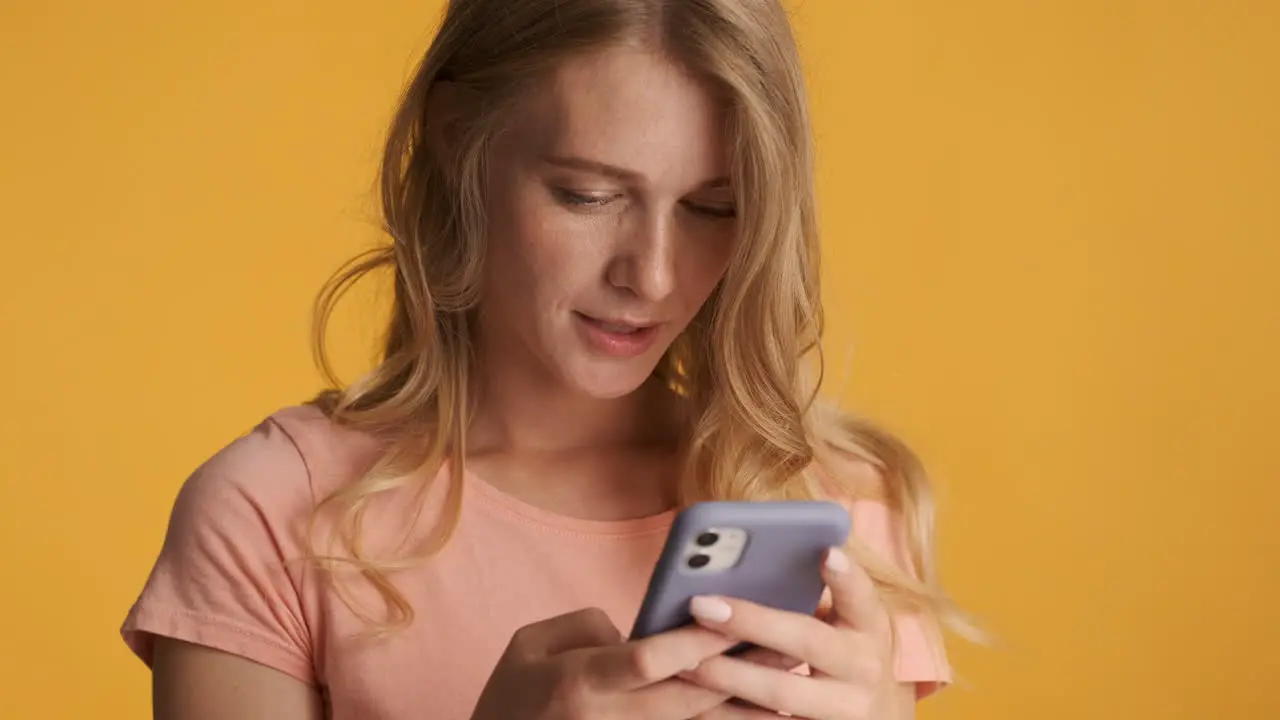 Caucasian woman texting on smartphone