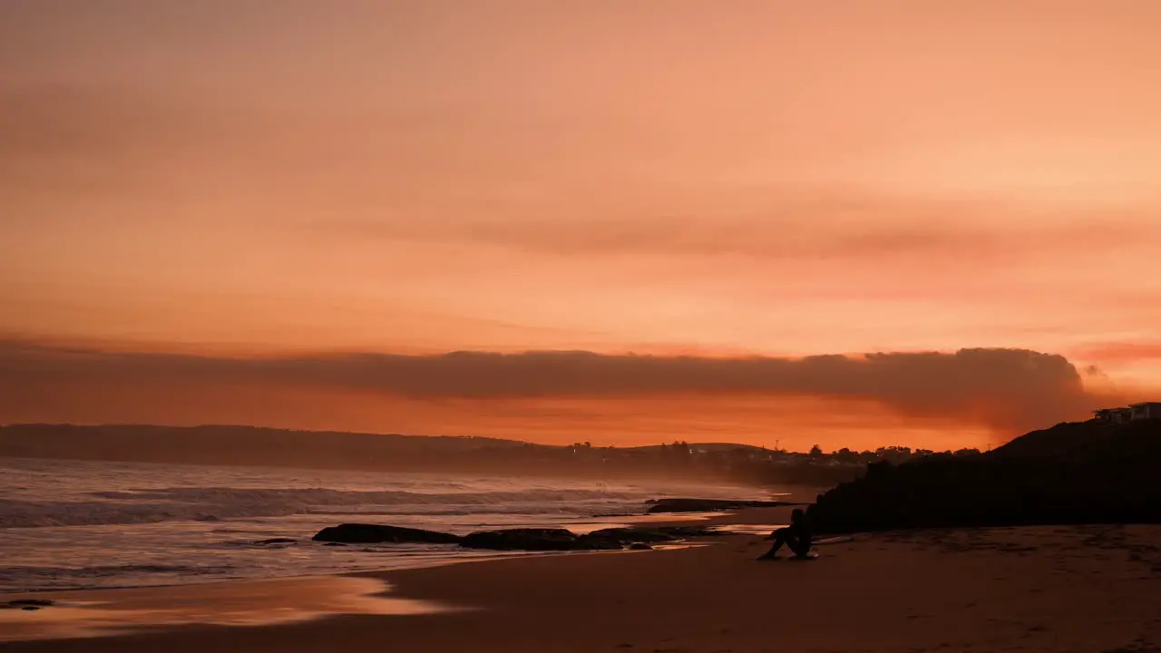 Amazing orange sunset running parallel with the beach