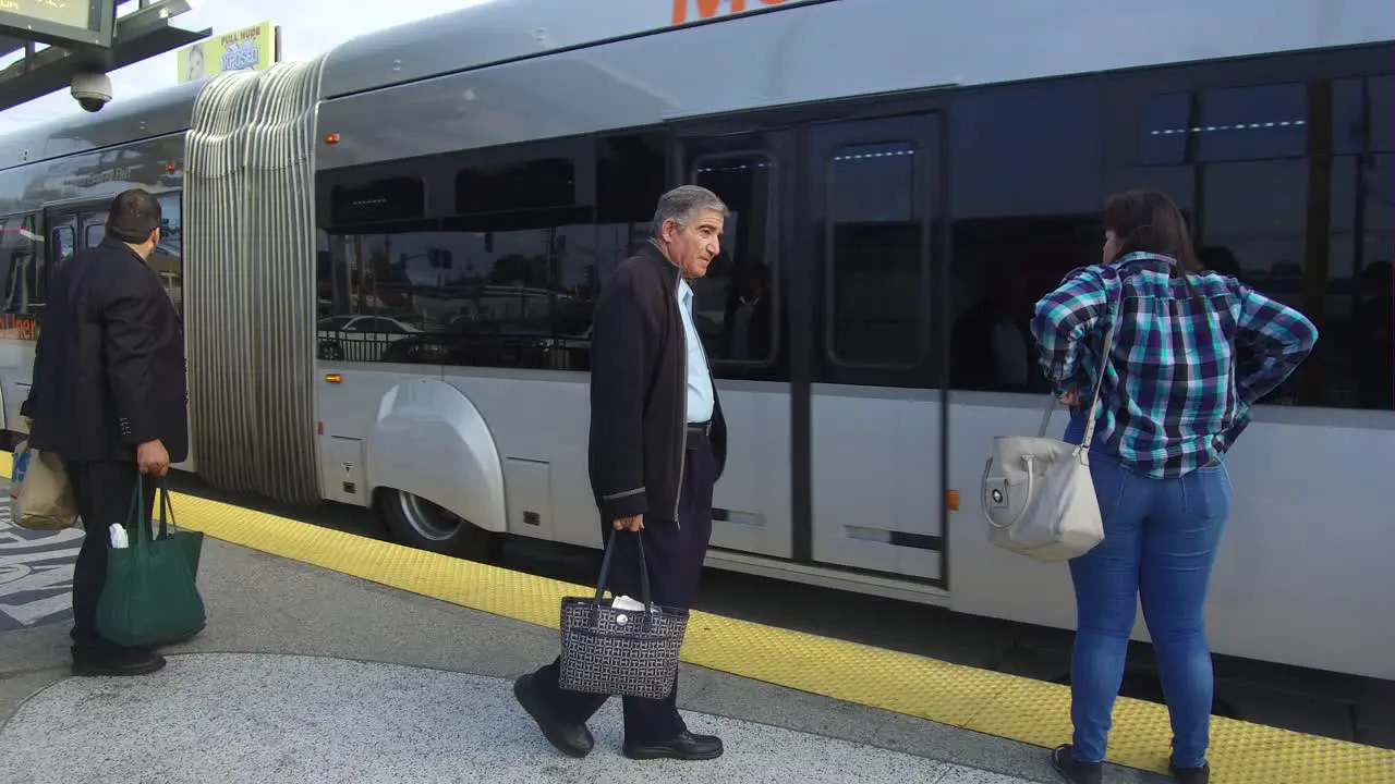 boarding a bus line at station