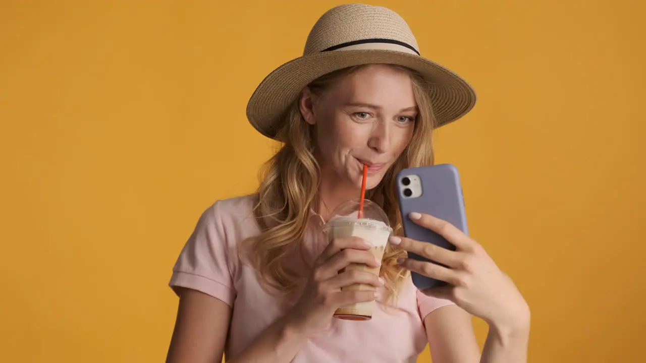 Caucasian woman taking pictures during summer holidays