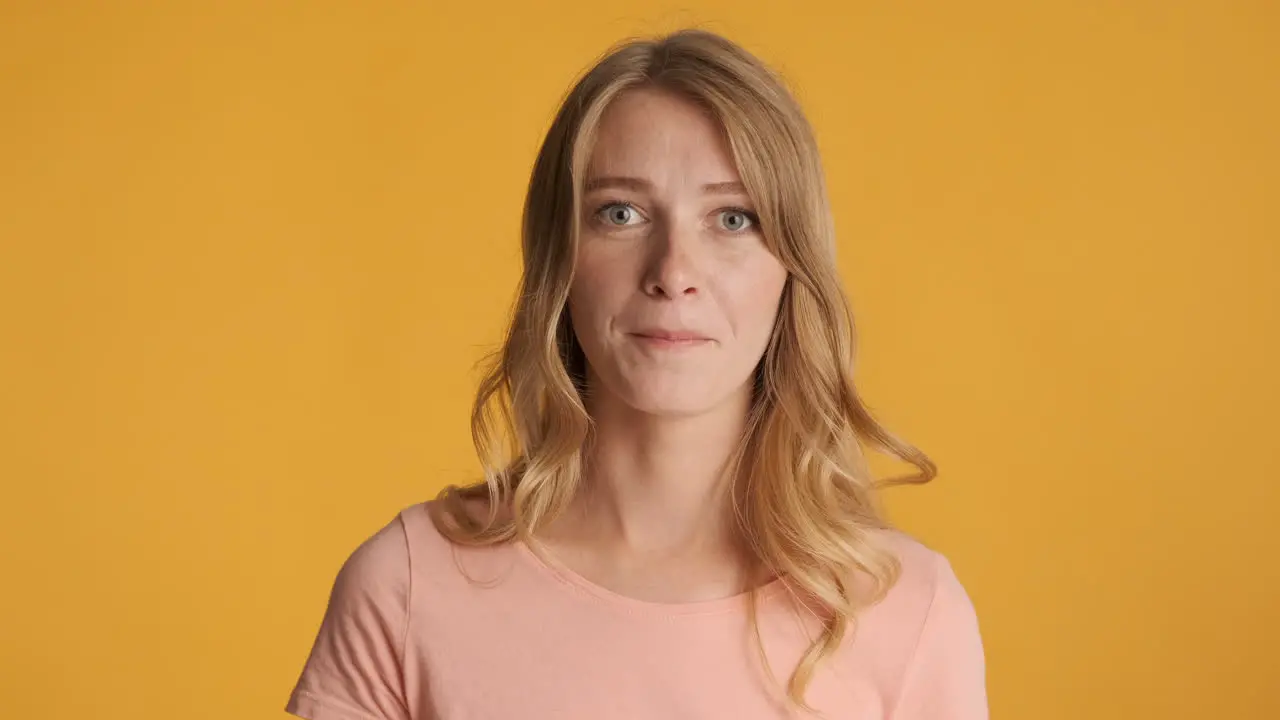 Upset Caucasian woman with tongue out on camera