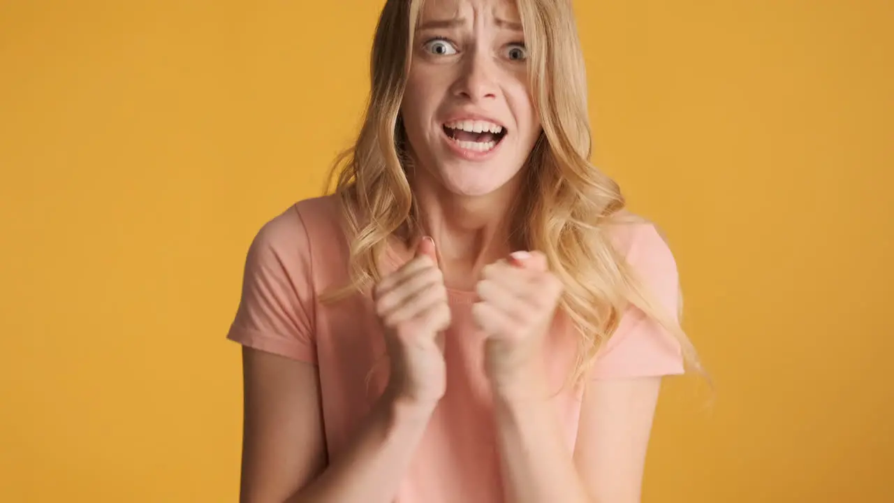 Nervous Caucasian woman receiving negative news on camera