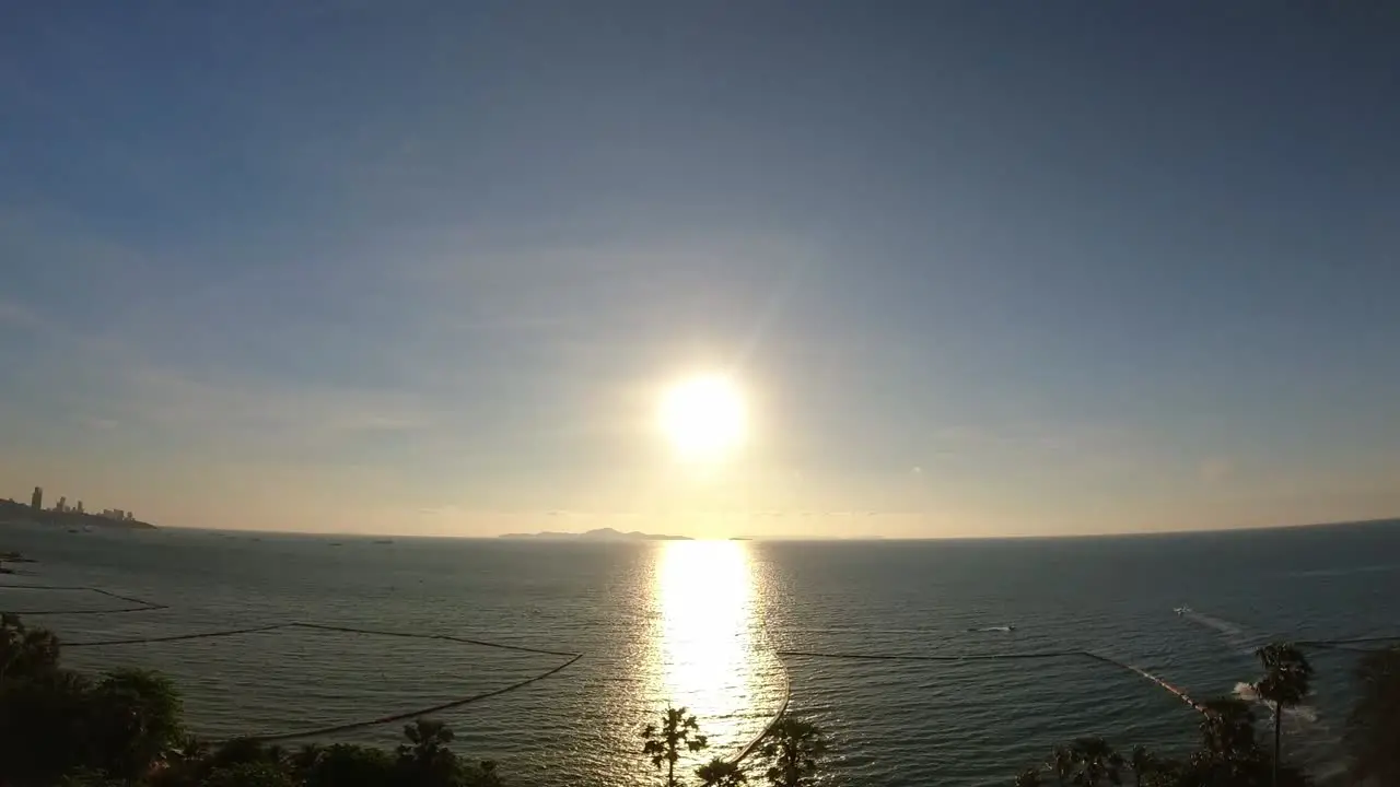 Spectacular aerial time lapse of an evening sunset overlooking the beach and ocean in Pattaya Thailand