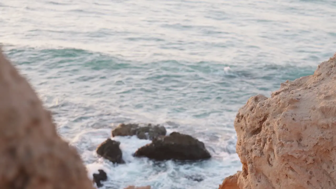 waves breaking over rocks in Hadera beach Israel