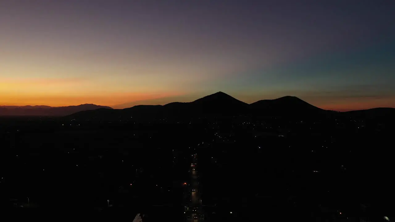 Sunset over texcoco in november with silhouettes of mountains