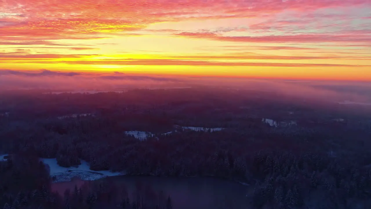 Fire sunset with vibrant sky over horizon aerial