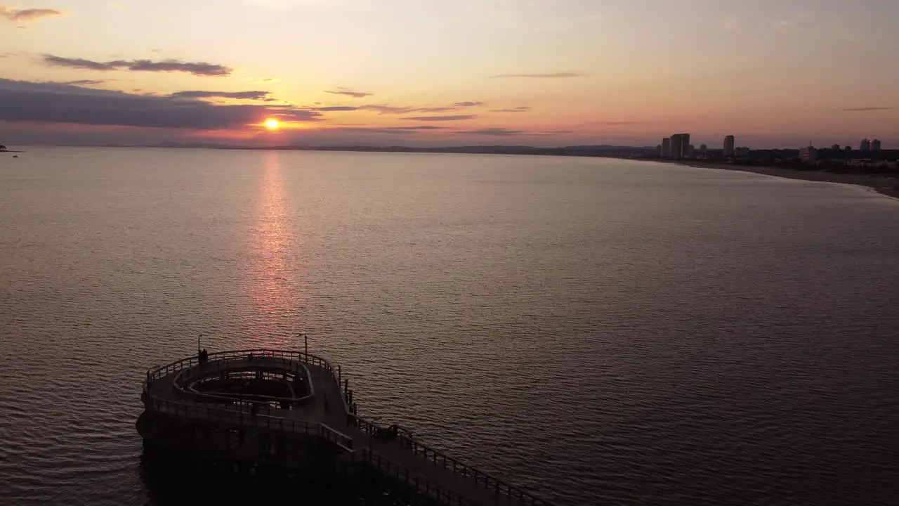 Aerial view of dock of Punta del Este Beach during golden sunset in the evening Uruguay South America