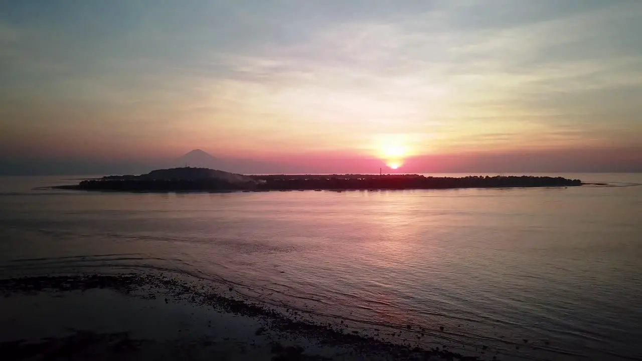 Sunset view of a volcano from a beach