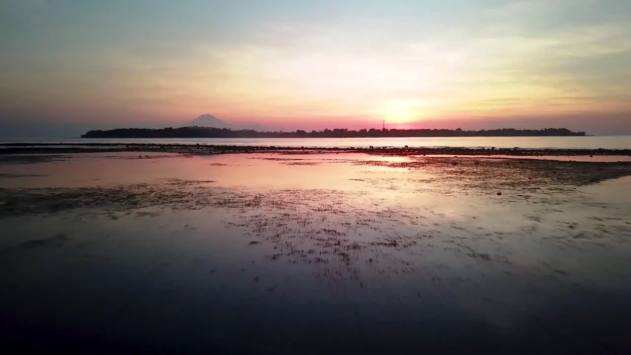 Sunset view of a volcano in a distance