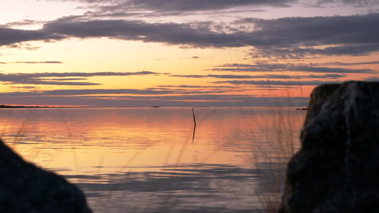 Beautiful and colorful sunset over Baltic Archipelago with calm Baltic sea