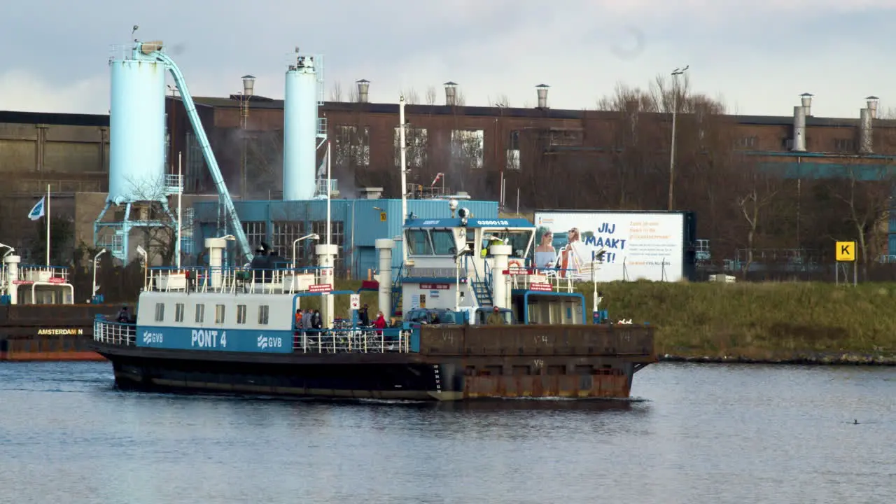 Following Amsterdam ferry crossing river