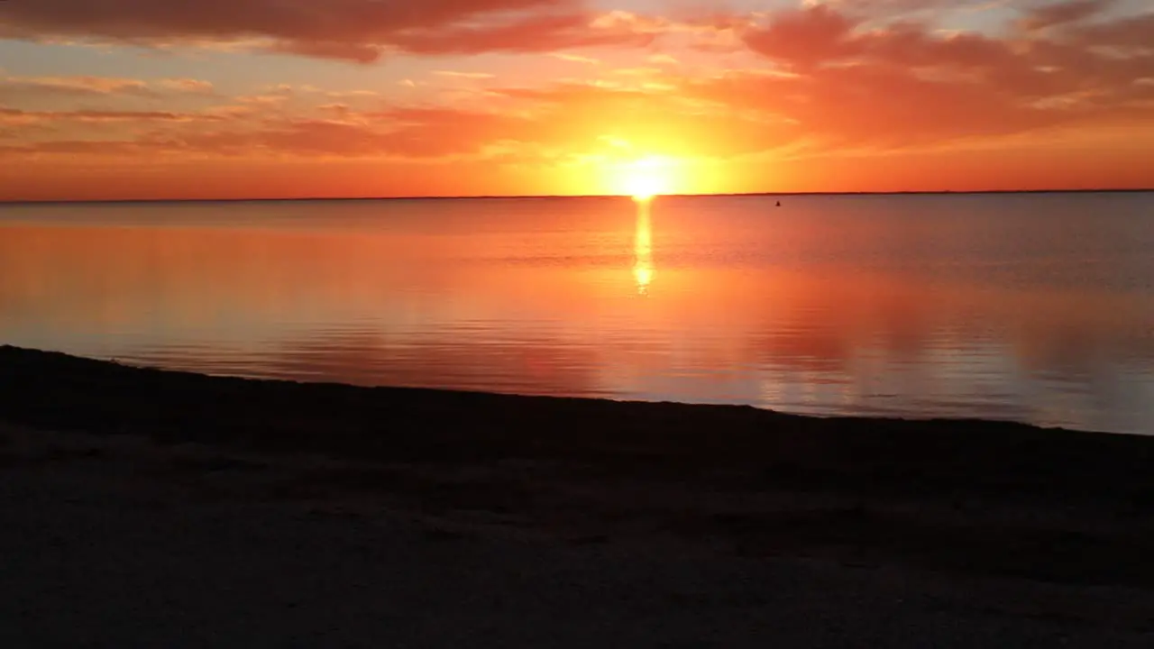 Dazzling sunset over a calm Laguna Madres estuary at North Padre Island National Seashore along Gulf Coast of Texas