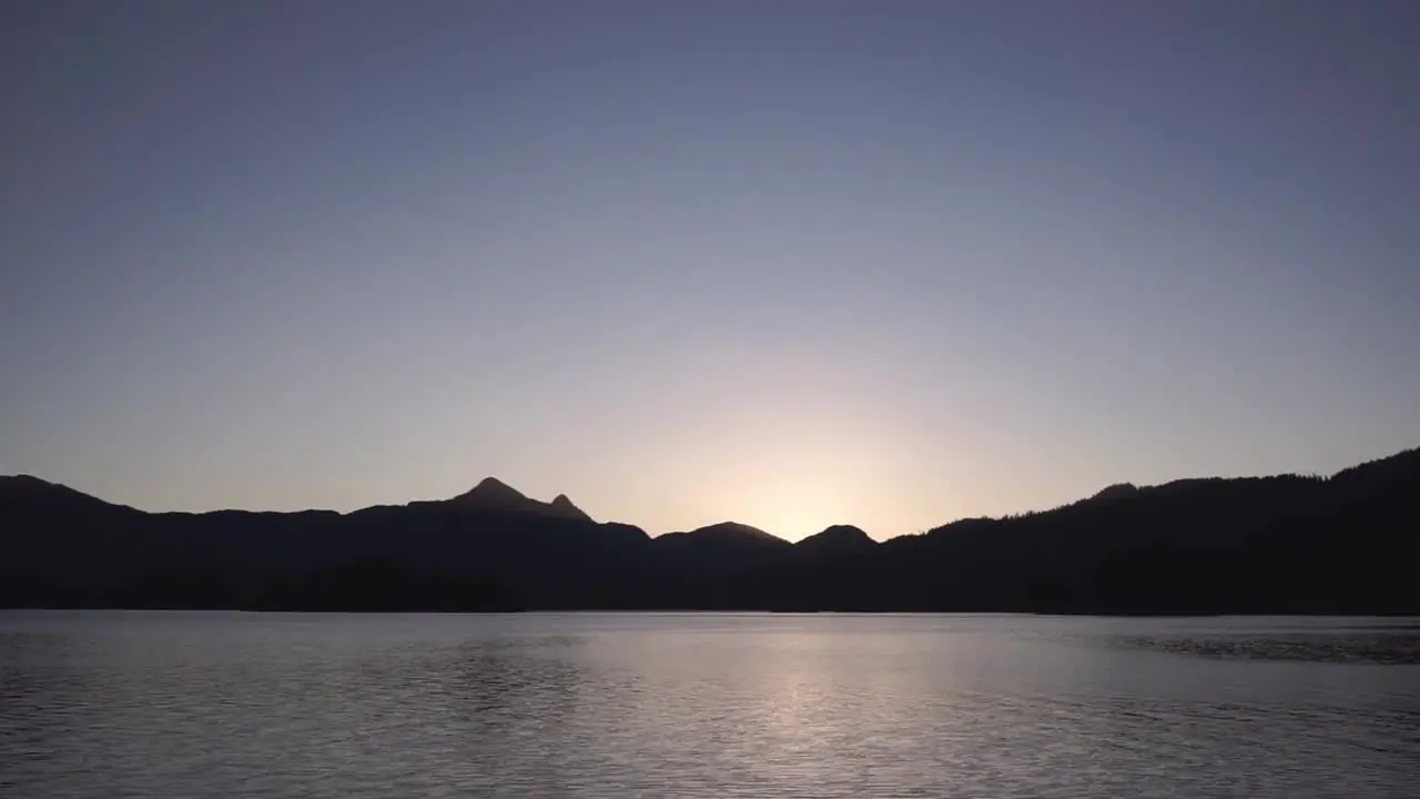 Sunset over Long Arm inlet mountains Queen Charlotte Haida Gwaii