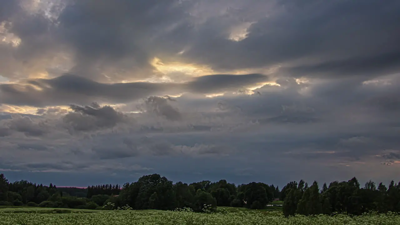 Sun rays shine through clouds