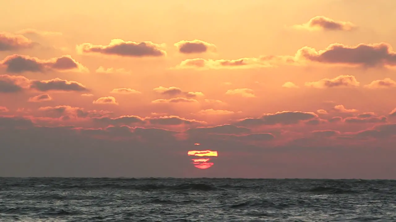 Creamsicle orange and golden sunset over Southwest Florida Gulf of Mexico