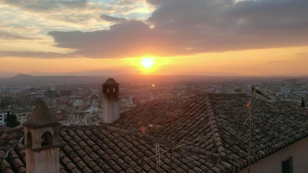 Sunset overlooking tiled rooftop in Granada Spain