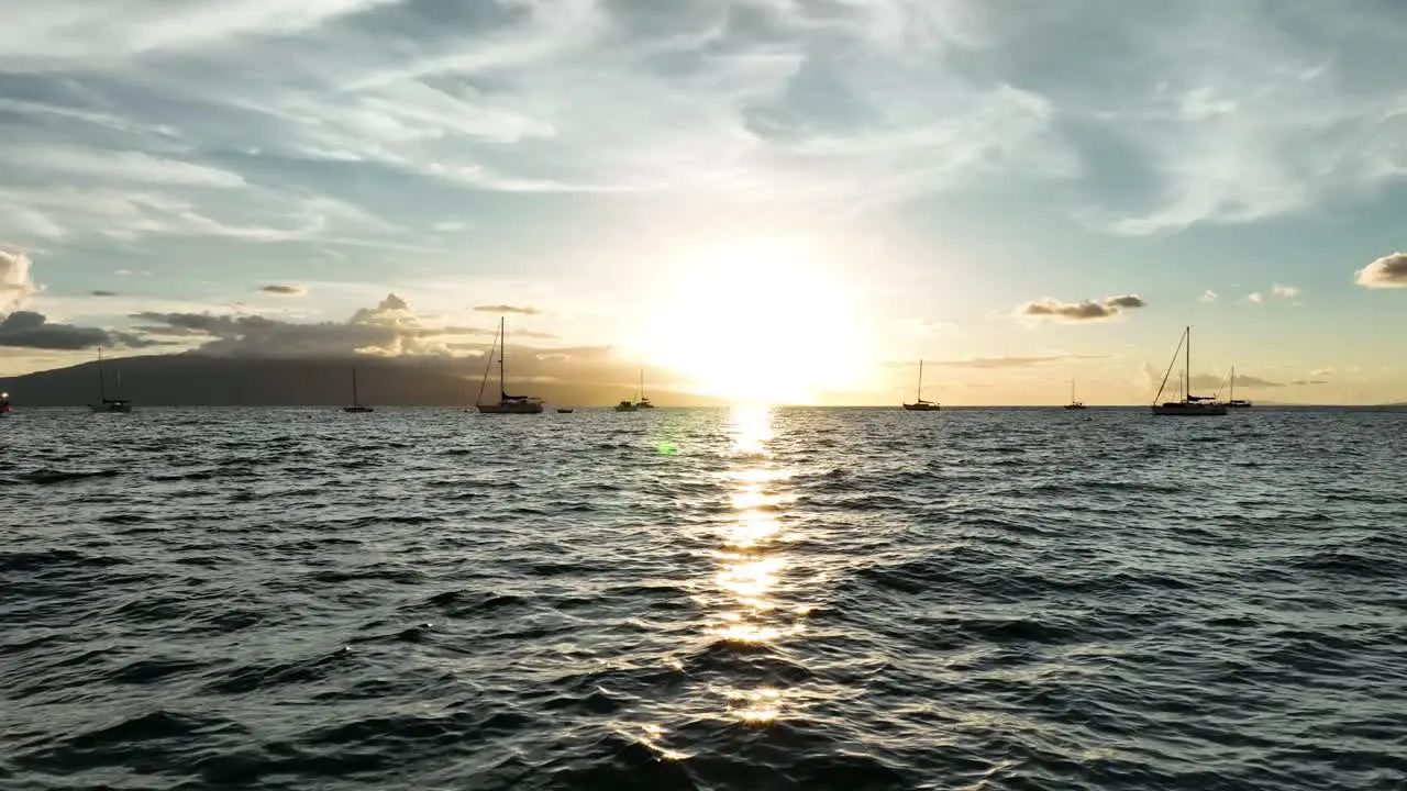 Sunlight glistening over the calm waters of Lahaina