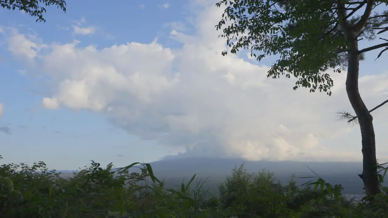 A cinematic timelapse captures the dynamic beauty of Fuji mountain beneath a massive unyielding cloud