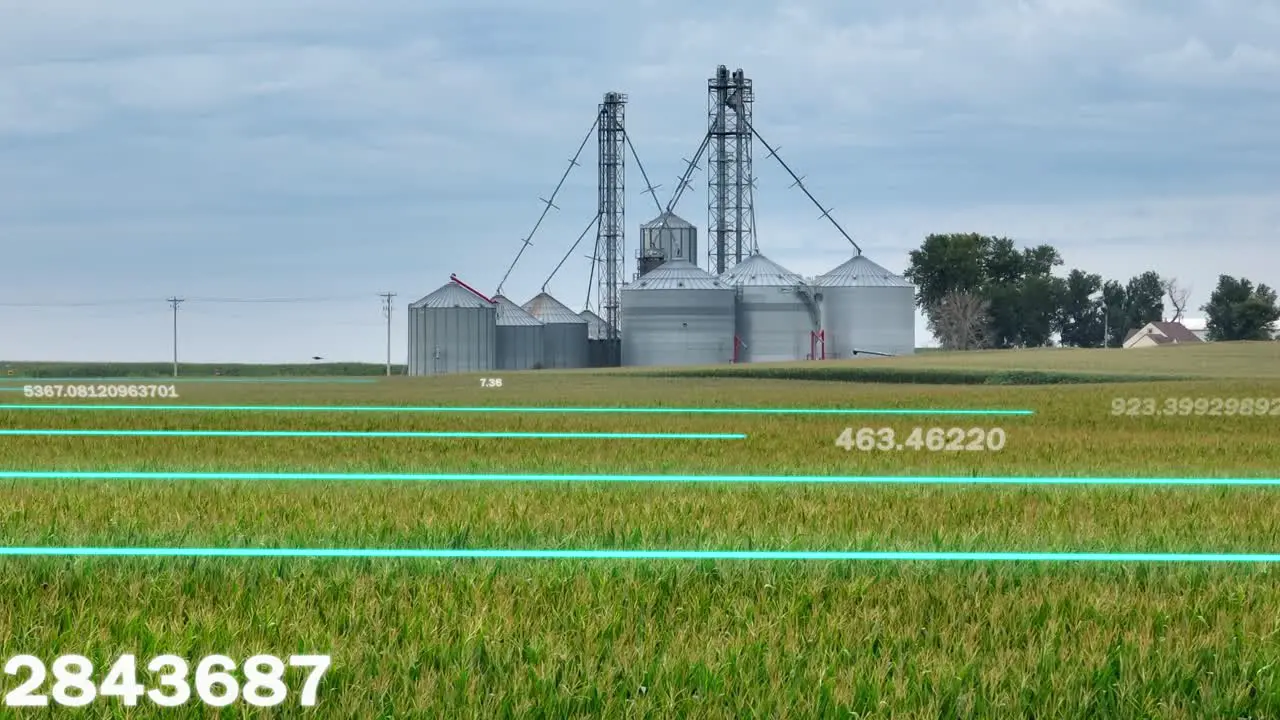 Agricultural silos and farmland overlaid with data metrics representing smart farming technology