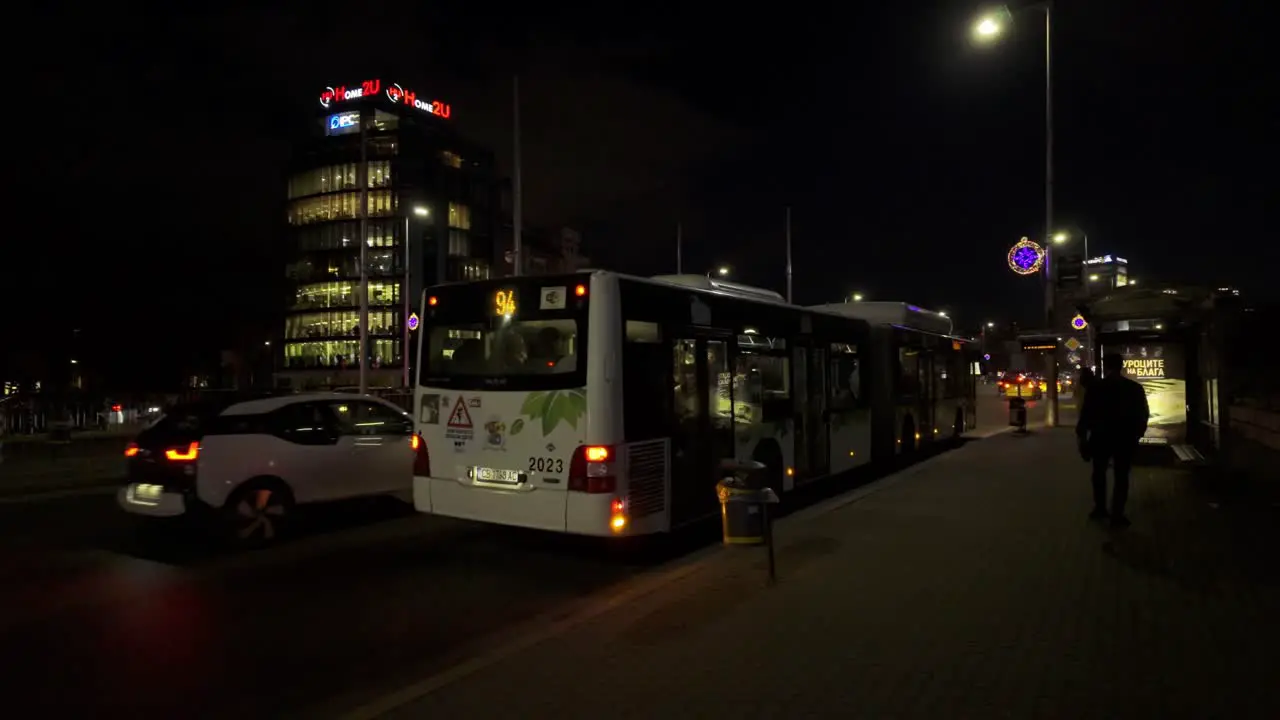 public bus 94 taking off from a bus stop 'Cherni vrah blvd' at night