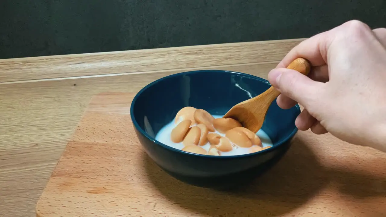 Sweet cookies in milk for a snack -stop motion