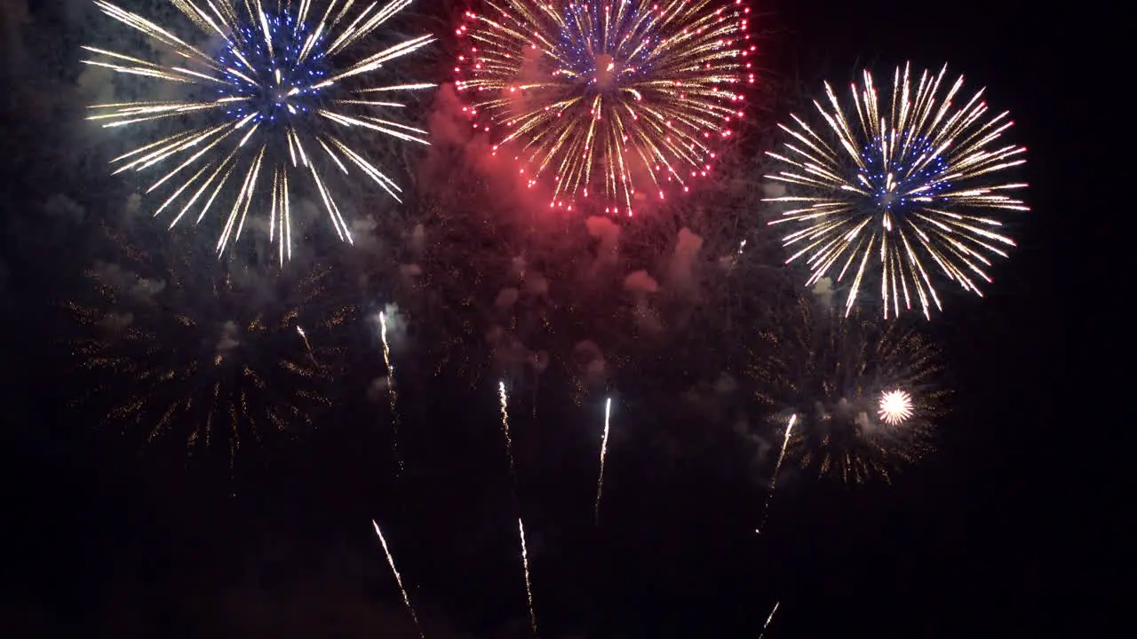 Happiness and enjoyment with colorful fireworks on dark background