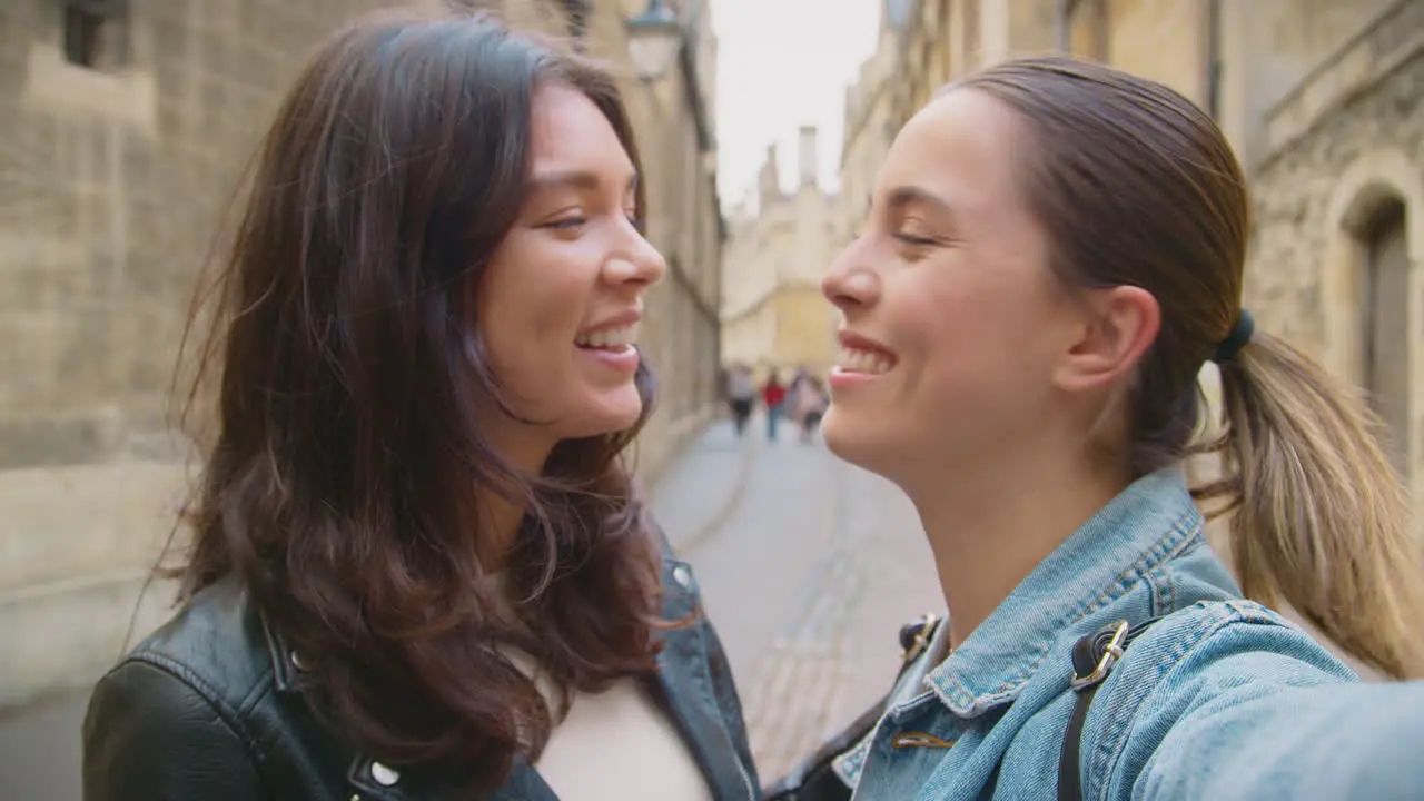 POV Shot Of Same Sex Female Couple Pose For Selfie As They Visit Oxford UK Together