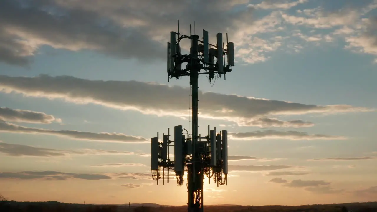 Aerial silhouette of cell phone tower