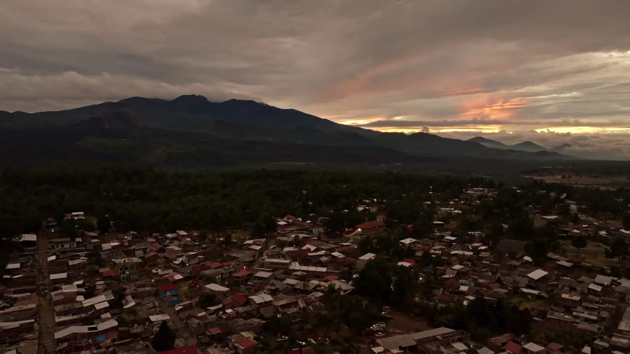 PARICUTIN VOLCANO AT SUNSET WITH ANGAHUAN TOWN